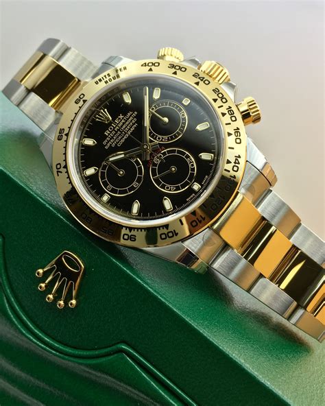 steel and gold rolex daytona